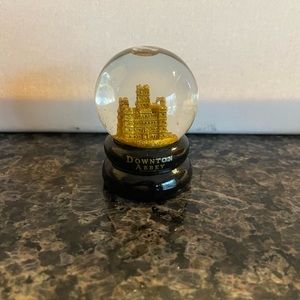Downton Abbey mini snow globe.  Adorable item and a conversation piece.